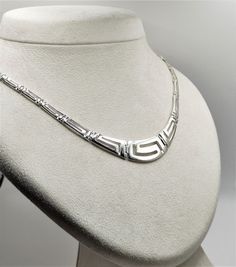 Buy a unique Handmade Silver Necklace with Greek Key Meander | Discover a large collection of Ancient Greek Jewelry in our ON-LINE shop | FREE SHIPPING all over the world This product is a beautiful silver 925 Necklace inspired by the Ancient Greek Key pattern-Meander.A meander or meandros (Greek: Μαίανδρος) is a decorative border constructed from a continuous line, shaped into a repeated motif. Such a design is also called the Greek fret or Greek key design. Visit my Home Page: https://www.etsy.com/shop/GreekHistoryArt Type We offer 1 type of necklace  Size Length:Adjustable Width:1.3cm(0.52 inches) IF YOU WANT OTHER SIZE PLEASE CONTACT US Material All my products are pure Sterling Silver. This necklace is Shiny Silver and degrade. If you wish to see more products with Meander, please vis Classic Handmade Silver Necklaces, Ancient Greek Jewelry, Greek Temple, Ancient Greek Coin, Greek Vases, Greek Key Pattern, Greek Jewelry, Continuous Line, Key Design