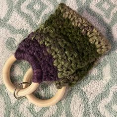 a close up of a knitted object on a towel with a ring in the middle