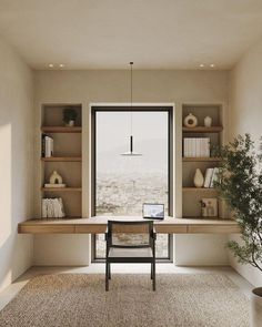 a room with a desk, shelves and a chair in front of a large window