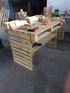 a workbench made out of wooden pallets