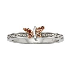 Featuring beautiful red and white diamonds, this butterfly ring offers soaring style.Ring Details: Width: .65 in. Metal: rose & white rhodium-plated sterling silver Diamond Details: Total weight: 1/10 ct. Cut: round Color: red, white Setting: prong Image(s) may be enlarged to show detail.Diamond weights are approximate. Diamond total weights may vary between .01 and .08 ct. Some diamonds have fewer than 17 facets.Gemstones may have been treated to enhance their appearance. Special care may b White Gold Butterfly Ring With Diamond Accents, Butterfly Shaped Anniversary Rings With Diamond Accents, White Butterfly Ring For Anniversary, White Butterfly Ring With Diamond Accents For Anniversary, White Butterfly Ring With Diamond Accents, White Butterfly Ring With Diamond Accents For Promise, Diamond Butterfly Ring, Diamond Butterfly, Right Hand Rings