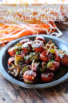 a plate full of cooked sausage and peppers with text overlay that reads whiskey glazed sausage and peppers