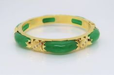 Vintage 18K Solid Yellow Gold Translucent Green Jadeite Jade & White Topaz Bamboo Bangle Bracelet ....Marked 18K...Total of weights 30.8grams...Measure inside 53MM W 8.1MM...With 06 Green Jades 21.5 x 7.5MM ...It's in very good condition. #475680 Luxury Green Gemstone Bangle, Green Bangle For Formal Occasions, Fine Jewelry Style, Gold Jade Bangle Bracelet, Green Bangle Bracelet For Anniversary, Green Bangle Bracelets For Anniversary, Elegant Jade Bangle, Fine Jewelry Green Bangle For Anniversary, Green Fine Jewelry Bangle For Anniversary, Green Jade Bracelet For Wedding