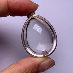 "Name: Natural Clear quartz crystal \"stone in stone\" silver pendant Material : natural clear quartz Weight :18.5 g approx Size: 38 mm*27 mm*16 mm approx All of our crystals & stones are natural and have formed over millions of years. They are not reconstituted nor lab-grown.Because they are natural, each piece may have inclusions, natural lines or indentations.This is normal and part of the natural material. These are natural crystals and will have flaws. Please examine carefully to determine Spiritual Silver Drop Crystal Necklaces, Silver Mineral Crystal Pendant, Crystals Stones, Natural Line, Clear Quartz Crystal, Crystal Stone, Color Calibration, Natural Material, Clear Quartz