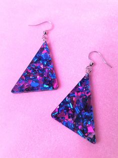 Choice of sterling silver .925 or surgical stainless steel Approximately 1.25" wide, and 2.5" long from top of metal hookRad chunky colorful glitter earrings! Inspiration straight from the 80s, redesigned for the new retro look. These earrings are sure to sparkle, and packed full of color! Glitter placement will vary for each pair of earrings, making them unique to you! Check this link for mini versions! Mini 80s Inspired Chunky Glitter Triangle Earrings | More Colors! – retroeloThis product is Drip Aesthetics, Shein Earrings, 90s Vaporwave, 80s Accessories, Speculative Design, 80s Jewelry, 80s Earrings, Colorful Glitter, Vaporwave Aesthetic