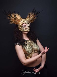 Coiffe ... Reine des EnfersHeaddress "Fraise au Loup Studio"Mask Valkyrie feather headgear. Gold / Black Gradient PaintDecoration gold patina. Baroque moldings made by the AtelierUnique creation of the workshop. Crafted, carved and hand paintedUnique CreationAdjustable elastic link for holdingIdeal accessory for a stage - Cabaret - Burlesque - Drag queen ... or photo shootsFacebook page - https://www.facebook.com/fraiseauloupcostumes Cabaret Burlesque, Cabaret Costume, Burlesque Costume, Costume Masks, Costume Mask, Armor Concept, Fantasy Clothing, Headdress, Fancy Dress