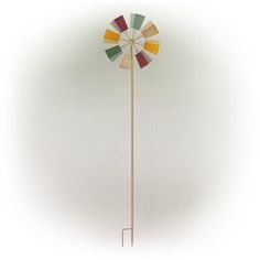 a wind spin on a white background in the shape of a windmill with multicolored blades