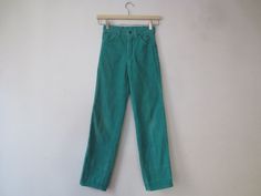 Seriously killer '70s/'80s Izod for Girls green corduroy pants in nice, broken in vintage condition. There are regular signs of wear and washing. As pictured, there's a white discoloration just below the knee of the left leg. These were hemmed up at some point as you can see two creases above each ankle and the waist was cinched in back. Otherwise no major flaws to note. Tags read: Izod for Girls, Lacoste, Made in Indonesia, RN 40117, Size 10 Slim, 85% Cotton, 15% Polyester, (machine washing ins Green Corduroy Pants, 80s Girl, 70s Photos, Pants High Waisted, Green Corduroy, Pocket Jeans, Corduroy Pants, Vintage 70s, Alligator