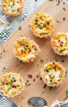 mini quiches with cheese and bacon on a cutting board