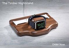 an apple watch sitting on top of a wooden tray