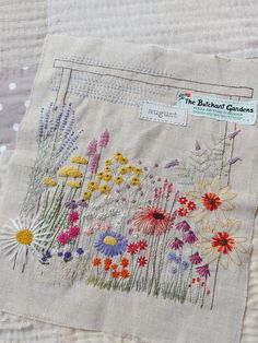 the back of a piece of fabric with flowers on it and a label that says, the