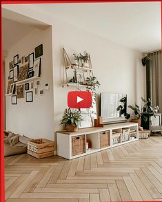 a living room filled with furniture and lots of pictures on the wall next to a flat screen tv