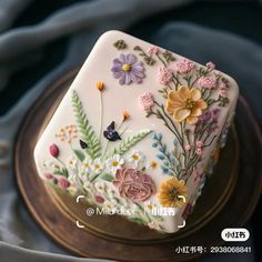 there is a cake decorated with flowers on it