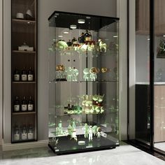 a glass display case filled with lots of bottles