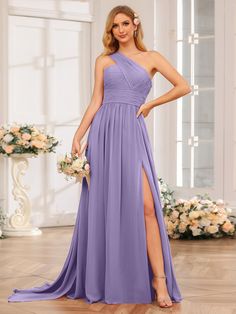 a woman in a purple bridesmaid dress posing with her legs on the floor