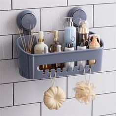 a bathroom shelf with soaps, lotions and other items hanging on the wall