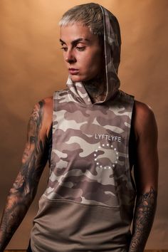 Hooded Two performance panels Antibacterial and anti-odor technology Triple-blend fabric Loose fitting Scoop neck design Polyester/Elastane Our fan favourite is back in a camo series! This women's sleeveless tank top made with our triple-blend fabric provides an antibacterial, anti-odor and sweat-wicking piece – more wear, less wash. This high-tech fabric also holds its shape and is wrinkle-resistant. The loose fitting design has a wide arm opening and hood. Dominate adversity tab paying attenti Desert Camo, Sleeveless Hoodie, Sleeveless Tank Top, Sleeveless Tank, High Tech, Neck Designs, Stylish Women, Camo, Scoop Neck