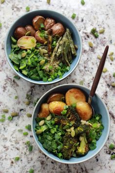 two bowls filled with different types of food on top of a marble countertop next to each other