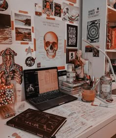 a laptop computer sitting on top of a white desk