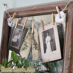 an old frame with clothes pins and pictures hanging on it