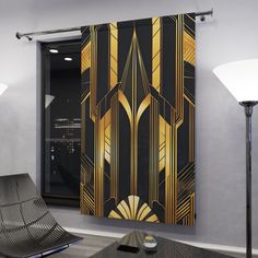 a black and gold art deco wall hanging in a living room next to a lamp