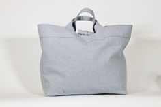 This tote bag is crafted from 100% sustainable eco-cotton, in a light blue upcycled denim material. Perfect for everyday use, to hold all of your essentials. Light Blue Denim Bag For Everyday Use, Denim Blue Cotton Bags For Everyday Use, Denim Blue Cotton Shopping Bag, Everyday Denim Blue Cotton Shoulder Bag, Blue Cotton Bags With Leather Handles, Everyday Upcycled Tote Canvas Bag, Everyday Upcycled Canvas Tote Bag, Denim Blue Cotton Canvas Bag For Daily Use, Light Blue Cotton Bag For Daily Use