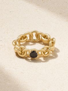 Astronomy is often the starting point in Spinelli Kilcollin's designs - this ring is inspired by the 'Serpens' constellation, named in Greek mythology for its resemblance to a snake. Made from 18-karat gold, it's comprised of hand-rolled chain links and dotted with a single blackened diamond. Luxury 14k Gold Chain Ring, Luxury Tarnish-resistant Chain Ring For Formal Occasions, Formal Yellow Gold Rings With Black Spinel, Gold Jewelry With Black Spinel, Gold Jewelry With Round Black Spinel, Luxury Black Spinel Round Ring, Tarnish Resistant Round Chain Ring For Formal Occasions, Round Tarnish Resistant Chain Ring For Formal Occasions, Tarnish Resistant Chain Ring For Formal Occasions