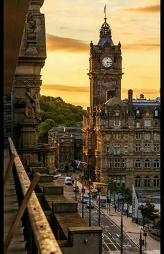 a large clock tower towering over a city