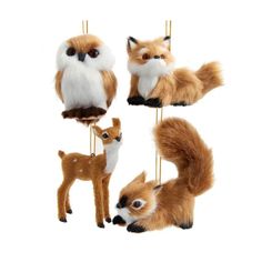 three different types of stuffed animals hanging from clothes pins with strings in the shape of an owl, fox, and deer