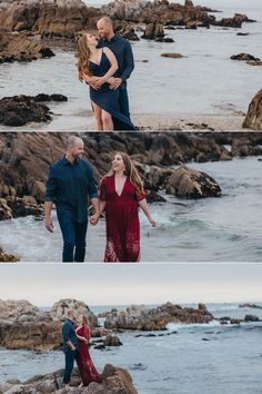 an engaged couple standing on rocks by the ocean