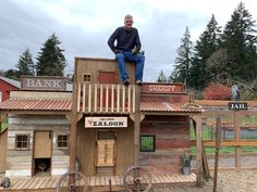 My husband built a western theme chicken coop Wild West Chicken Coop, Chicken Town Coop, Saloon Chicken Coop Plans, Chicken Coop Western Town, Chicken Coop Castle, Chicken Coop Saloon, Western Town Chicken Coop, Chicken Coop Village, Barnwood Chicken Coop