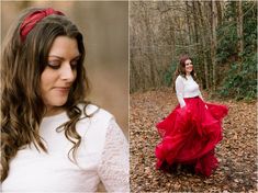 a woman in a red skirt and white shirt standing in the woods with her hands on her hips