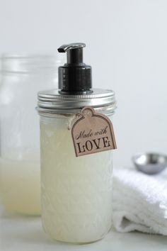 a soap dispenser sitting on top of a white towel