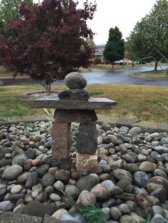 a stone bench sitting on top of a pile of rocks