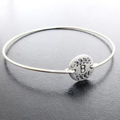 "Please mention initials needed in \"notes\" during checkout for your vine motif monogram bridesmaid initial bracelets. I can also add a FREE SECRET 2nd initial, number, footprint, star, horseshoe or heart on the back... Please mention in notes during checkout. I make these personalized initial bangles on your choice of silver plated disc with bangle band in silver filled or sterling silver-- or on a gold plated disc with bangle band in brass or 14k gold filled bangle-- or on a copper plated dis Adjustable Monogram Bracelet As Personalized Gift, Adjustable Monogram Bracelet For Personalized Gift, Silver Initials Bracelets For Wedding, Customizable Silver Name Bracelet For Bridesmaid Gift, Silver Initials Bracelet For Wedding, Adjustable Monogram Jewelry For Wedding, Silver Name Bracelet With Initials For Wedding, Adjustable Monogram Bracelets For Anniversary, Adjustable Monogram Round Bracelets