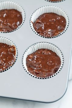 chocolate cupcakes are in the pan ready to be baked