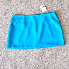 Lined Mini Skirt Bright Beautiful Aqua Blue Side Pockets Never Worn Perfect Condition Teal Mini Skirt, Trendy Blue Mini Skirt, Trendy Lined Blue Mini Skirt, Trendy Blue Stretch Mini Skirt, Trendy Stretch Blue Skirt, Blue Pencil Skirt Skort For Summer, Blue Stretch Mini Skirt For Spring, Blue Mini Skort, Blue High-waisted Flowy Skort