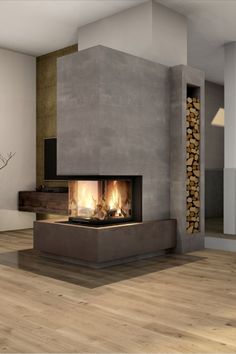 a living room with a fire place in the center and wood floors on both sides