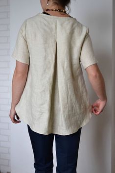 "ANNOUNCEMENT: due to the summer break on 7.08-16.08.2020, please place orders after 16.08.2020. Thank you, Bożena Light natural linen blouse for women. Blouse has round neckline and short length sleeves. The bottom side is made asymmetrical - front side is shorter, back side is longer. Very comfortable and soft natural linen blouse. This is the perfect women's shirt for work and beyond. Fabric: 100% linen (medium weight linen). Color: light natural SIZE S (body measurement): Bust: 88cm/35\" Wai Beige Linen Short Sleeve Blouse, Flax Linen Short Sleeve Blouse, Short Sleeve Linen Blouse In Flax Color, Loose Linen Shirt, Shirt With Sleeves, Summer Break, Linen Blouse, Shirt Short Sleeve, Perfect Woman