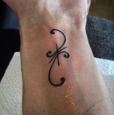 a person with a tattoo on their foot