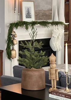 a living room with a christmas tree in a pot