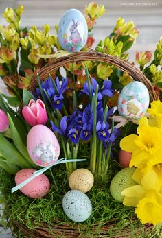 an easter basket filled with eggs and flowers