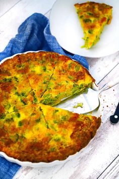 a quiche with broccoli and cheese is cut into slices