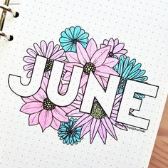 a notebook with the word june written on it