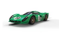 a green race car on a white background with no one in it's photo