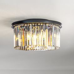 This odeon round crystal flush mount is a elegant light fixture with a contemporary look that will add mid-century modern decor style to your home. Its two tiers and nine lights create plenty of warm, welcoming light. The sleek black finish frame is strong and durable. The clear crystal hangs around the frame that forms a round shade, each crystal comes with a thick, triangular profile that delivers maximum refraction and reflection, enhancing its visual profoundness and artistry even further. A Black Flush Mount Light, Wagon Wheel Chandelier, Light Fixtures Flush Mount, Mid Century Modern Decor, Dining Room Chandelier, Modern Round, Pendant Chandelier, Flush Mount Lighting, Everly Quinn