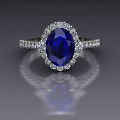 an oval shaped blue sapphire and diamond ring