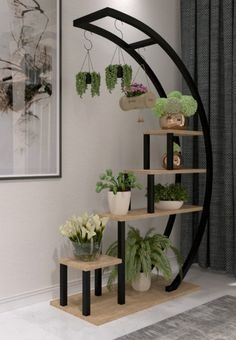 a set of shelves with potted plants on them in front of a wall hanging planter