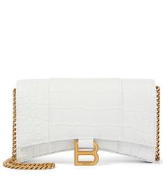 This wallet on chain is the latest member of Balenciaga's Hourglass family. In white hyperreal mock-croc, it's a serious fashion statement that's practical, too â" it has six card slots, another one for notes and a zipped compartment. | Balenciaga Hourglass leather wallet on chain White Balenciaga, High Heel Rain Boots, Wallet On Chain, Backpack Tote Bag, Wallet Chain, Handbag Backpack, Valentino Garavani, Shoulder Bag Women, Antique Gold