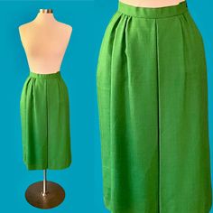 Vintage 80's Worthington bright green midi skirt *ITEM DETAILS* - Era- 1980's - Brand- Worthington  - Material- SHELL-50% Rayon 50% Polyester LINING- 100% Nylon  - Color- Bright Kelly green - Size- 10 (please see the measurements for an accurate fit)  - Fully lined - Side zipper and button closure *This item is in excellent (pretty much perfect!) vintage condition with no holes or stains.* *shown here on a size 6-8 mannequin, it was pinned about an inch at the waist* *measurements taken while fl Green Midi Length Lined Skirt, Green Lined Midi Skirt, Retro Green Midi Skirt, Green Midi Length Workwear Bottoms, Retro Green Knee-length Skirt, Green Retro Knee-length Skirt, Vintage Green Skirt For Spring, Vintage Green Skirt For Summer, Vintage Green Summer Skirt